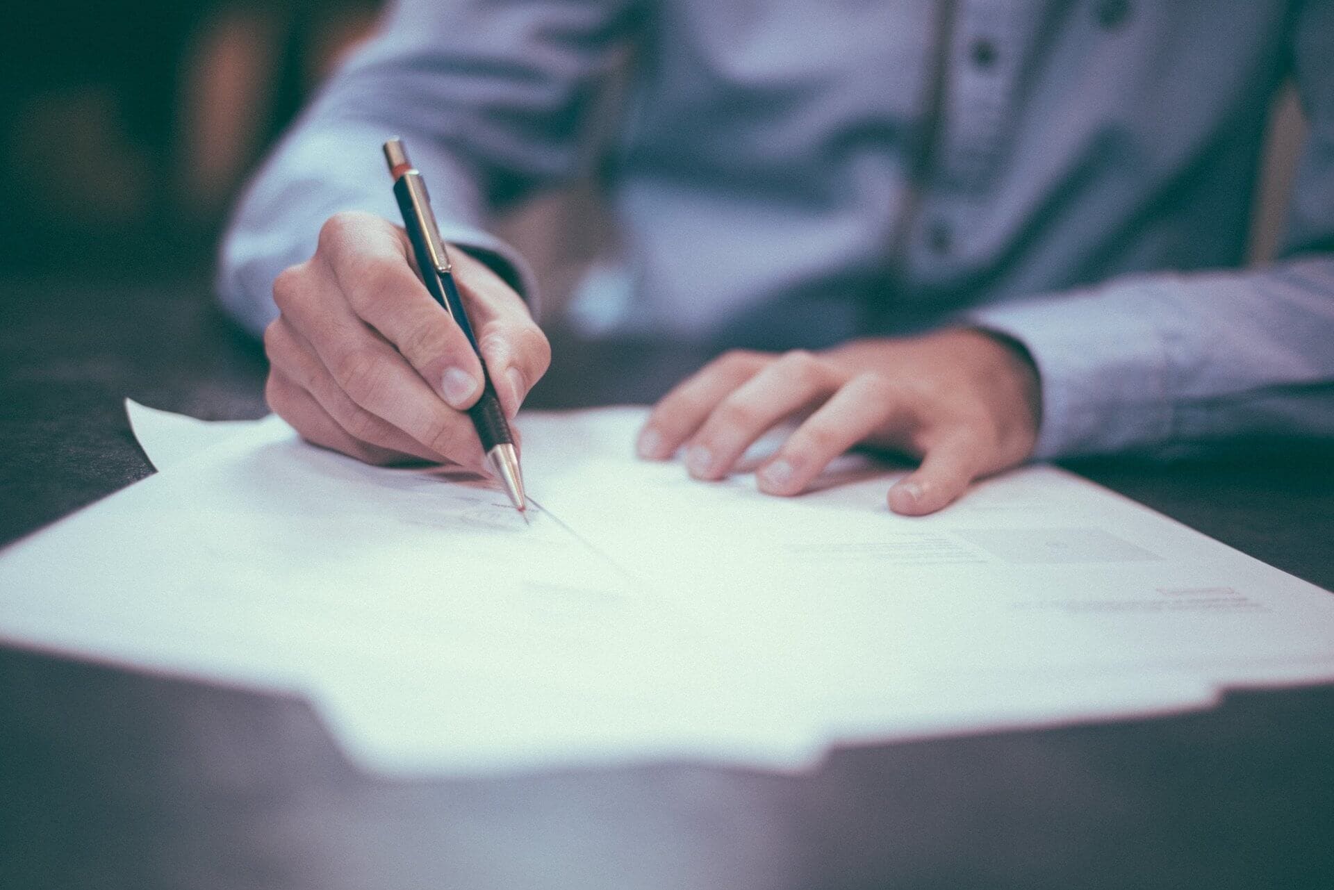 photo-1450101499163-c8848c66ca85 Signing a Real Estate Document